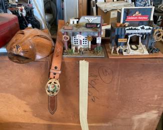Ceremonial Handmade Mask, El Dorado Sheriff leather belt, Saloon Bird House, and Line Dancers Anonymous Bird House