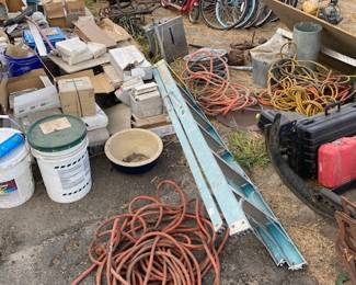Ceramic Tile, several heavy duty extension cords, 7 Bikes of different types and brands 1 of which is a Honda Bike and 1 Schwinn razor type scooter