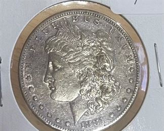 Collection of very old coins including Morgan, Peace and Carson City Silver Dollars