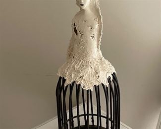 Ceramic sculpture on wire cage