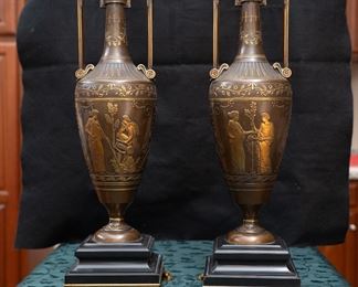 A wonderful and very high quality 19th. century French Greco-Egyptian St. ceremonial water vases in painted and gilt bronze. The complicated moulded Belgian black marble bases are supported with gilt lion claw feet to each corner. The body of the vases are decorated with Greek mythological figures in relief and are signed by the artist : Henry Cahieux (1810-1854)and forged and signed by : Ferdinand Barbedienne (1810-1892). Produced in France circa: 1850. 
