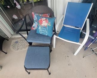 There are 2 chairs with ottomans