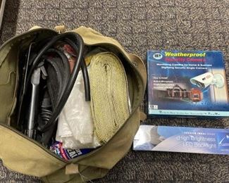 #2566 • Military Bag with tie downs and other items, weatherproof security camera and LED BookLight