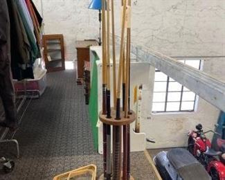 #2910 • 7 Pool sticks. Two 8 ball Racks one 9 ball rack two carrying cases