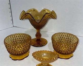 Amber glass diamond point pieces compote is 6 in tall