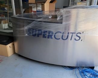 Retail wrap stand, register stand, checkout, nameplate comes off and can be rebranded