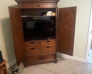 Solid wood wardrobe with oval mirrors. 