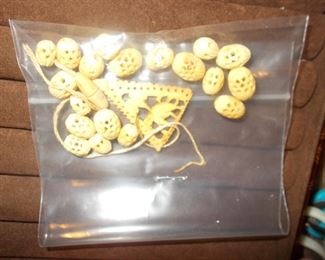 Carved beads and pendant needing repair