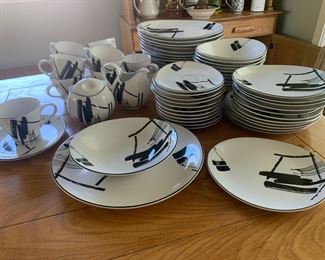 #236 Sango 12 place settings with serving dish and cream and sugar. Some pieces the glaze has cracked. $44