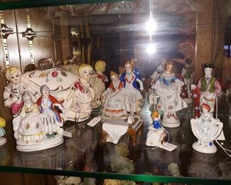 Many figurines from Japan or occupied Japan