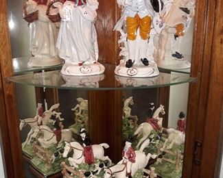 Capodimonte figurines and Fitz and Floyd Tally Ho bookends.