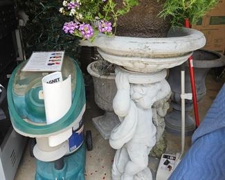 Mosquito machine, cement birdbath 