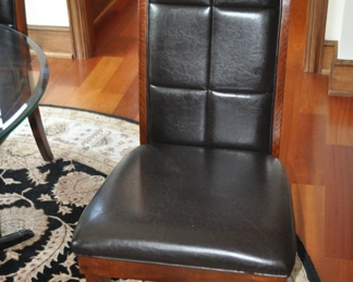 One of the 4 Black Leatherette and Walnut Side Chairs