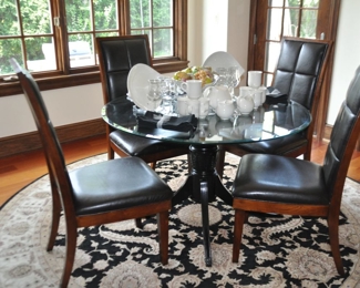 Wonderful Kitchen Dining Area Includes a 48" Round Beveled Glass Pedestal Dining Table and 4 High Back Chairs
