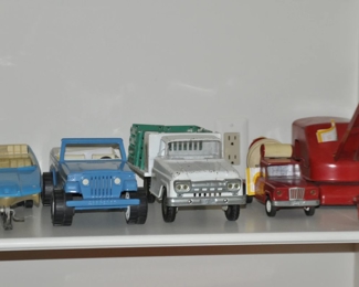 Vintage Tonka Steam Shovel, Vintage Tonka Cement Mixer, Vintage Green Giant Stake Truck and Vintage Tonka Jeep with Boat and Trailer. c. 1950's, 1960's and 1970's