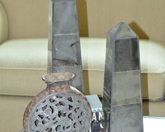 Up Close View of the Smokey Glass Obelisks and Carved Decorative Vase