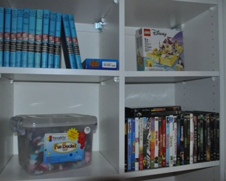 Vintage Hardy Boys Books Shown with Kids DVDs and Other Toys