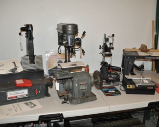 A Full Selection of Power Tools Included Lindell Bench Drill Press, Craftsman Grinding Wheel, Power Screw Driver, Craftsman Jig Saw,  Craftsman Router Table and Craftsman Power Planer