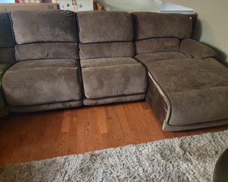 Large automated reclining sofa. **One side electrical has an issue and will need a new plug. Everything else works. 130" x 148"