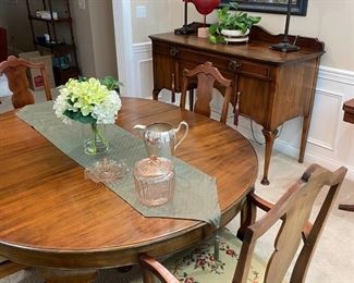 Beautifully restored antique Queen Anne dining table & large buffet.  Table is round without leaves.  Does come with 2 leaves.  Chairs have hand-made needlepoint seat covers.  
