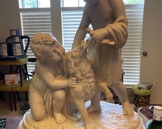 Marble dust statue, children at play with dog