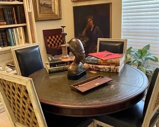 Leather topped pedestal table, and four chairs covered in Serengeti black leather with African Kuba Cloth insets  which was used as currency 