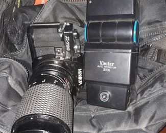 Minolta X-700 SLR camera with zoom lens and flash unit