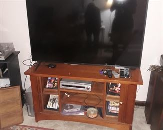 Sony 55"  screen television 
Below Stickley cabinet
