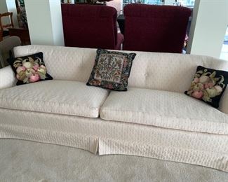 That cute sofa with some needlepoint pillows.  Yes please