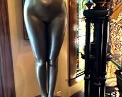 The Goddess Harmonia, composed of fiberglass from Design Toscano, standing on Lord Raffles wood and marble table