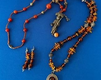 Asian necklace with carnelian and silver pendant; Amber and sterling necklace and earrings