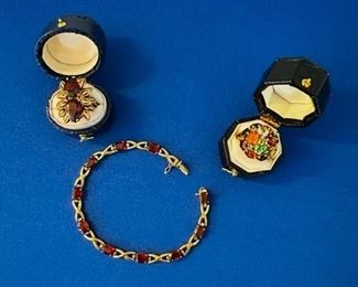 18kt garnet ring, 14kt garnet bracelet and 14kt gem ring