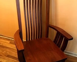 Captain chair, has a curved back