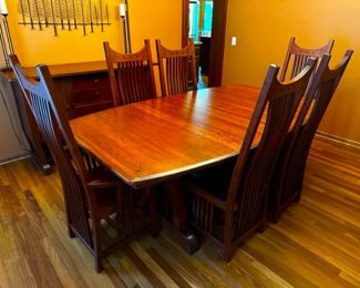 This table is made from cherry and is a boat shape with tapered ends. Measurements are approx. 48" wide and 70" wide (without leaves). Approx 94" long with leaves and pads.