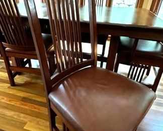 Detail of chair with brown leather seat cushion