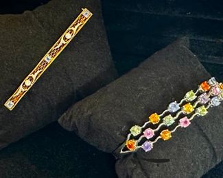 14kt diamond and sapphire pin and 18kt multicolor bracelet 