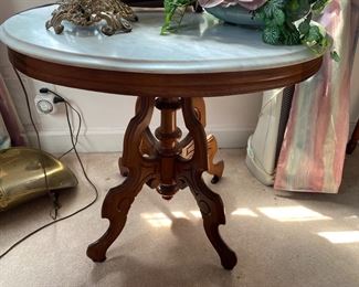 Oval marble top Victorian table