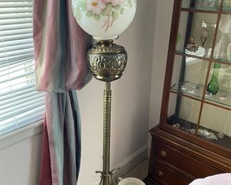 Brass floor lamp with globe shade