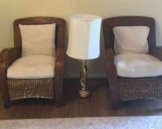 Two Pottery Barn chairs with off white cushions