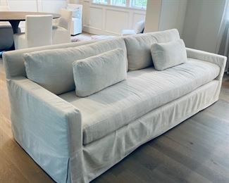 Restoration Hardware Belgian Track Arm slipcovered bench seat sofa. $3,500. Fabric is Perennials Performance Textured Linen weave in Natural. Cushions are down fill. Dimensions are 96"W x 37"D x 31"H