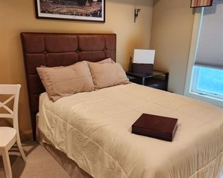 queen leather like headboard and bed