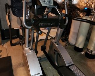 True elliptical, model ESX. Available for pre-sale. $500.00. Is in basement, BUYER must disassemble and remove