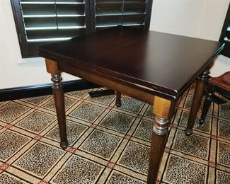 Arhaus table, unfolds for larger seating: 32" square as viewed