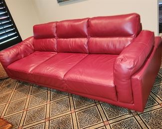 2 hot, red leather sofas! 90" long x 37" deep. 2 of these