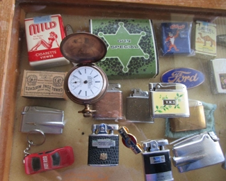 Pocket watch, vintage lighters, pin up girlie viewer