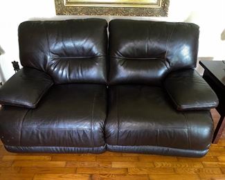 Leather loveseat with electric recliners