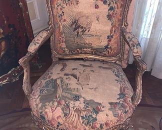 Set of 4 Louis XV gilt-wood armchairs. The chairs are upholstered with Beauvais tapestry with depictions of fables by Jean de la Fontaine 