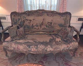 18th Century Louis XV style carved and Gilt wood Canape with tapestry upholstery which depicts a fable by Jean de La Fontaine