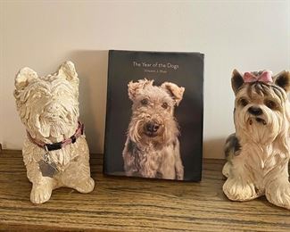 Dog Figurines and book "The Year of the Dogs" by Vincent J. Musi.