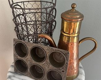 Metal baskets, copper kettle, muffin pan